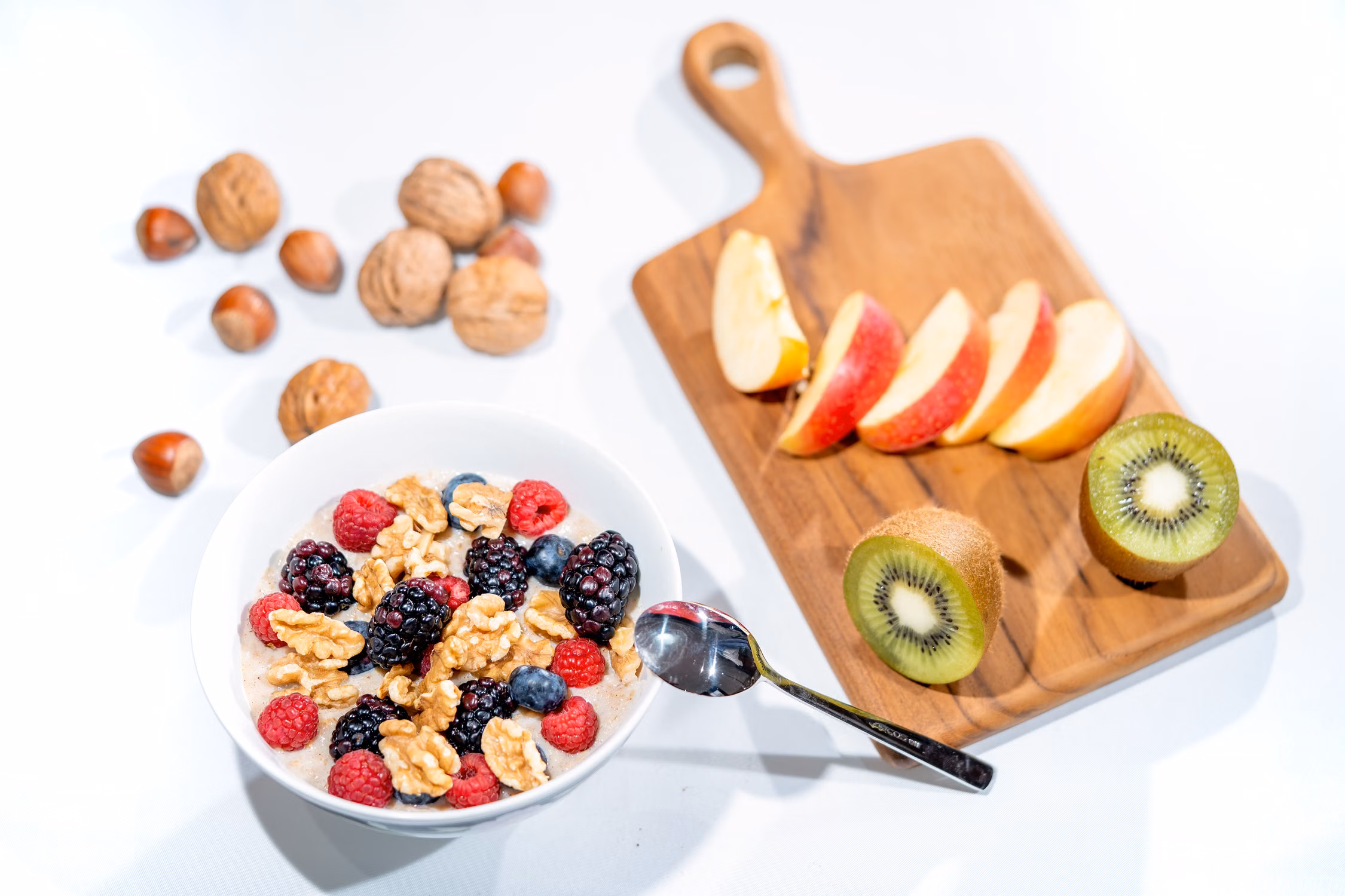 A colorful bowl of fresh berries, kiwi, and fruit